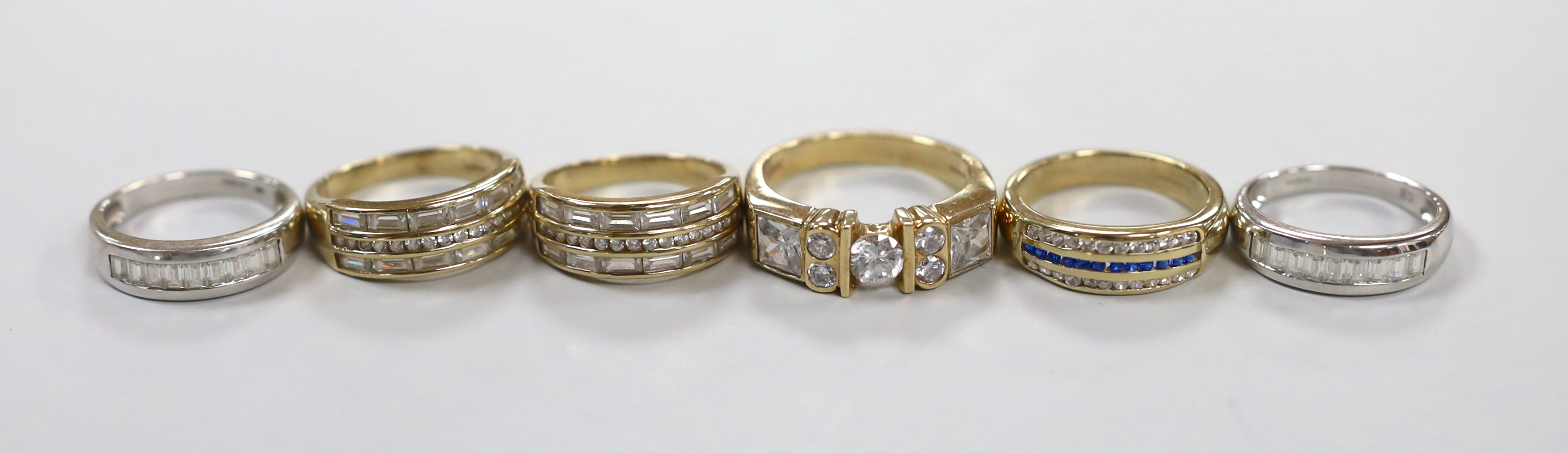 Six assorted modern 9ct gold and gem set dress rings including cubic zirconia, gross weight 32.5 grams.